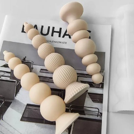 Haz velas decorativas modernas con este molde cilíndrico de esferas lisas y estriadas. Flexible, original y fácil de usar. - Cóm