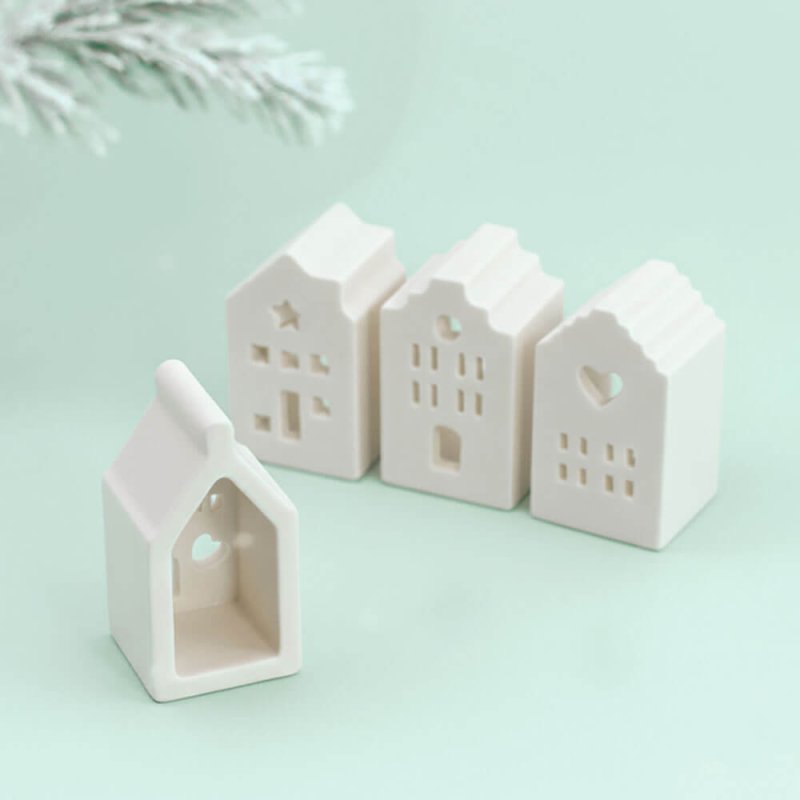 Molde de silicona con 4 casitas navideñas decoradas. Ideal para hacer figuras con cera, jabón o cemento. Flexible, reutilizable 